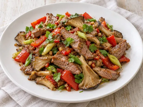 Lam in de wok met rode paprika en oesterzwammen